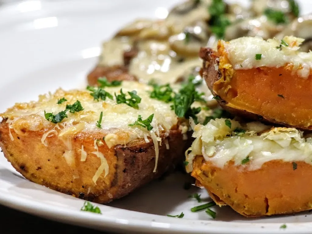 Cheesy garlic sweet potatoes