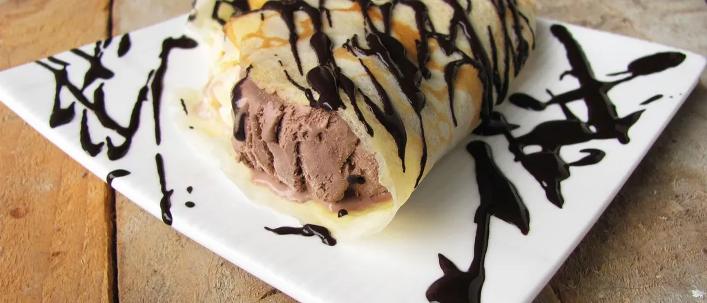 Crepes with icecream and chocolate syrup